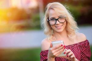 Portrait of smiling young woman outdoors photo