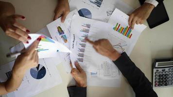 Top view of a business meeting with business charts. video