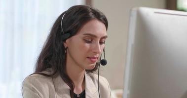 Businesswoman Wearing Headset Working in Office video