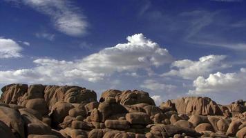 Billowing Clouds Over Huge Rocks video