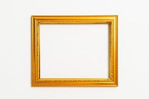 Empty picture frame on white wall background with copy space photo