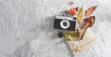 Autumn flat lay layout with vintage camera, word autumn photo