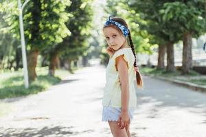 Beautiful girl in a summer sunny day photo