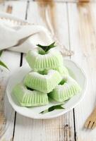 Indonesian Traditional steamed cake Kue Putu Ayu, made from rice flour, grated coconut, pandanus and suji leaves, photo