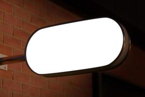 wall signage logo mockup with night light photo