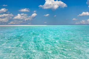Blue sea wave, ocean lagoon, white foam, sand beach, turquoise ocean water close up, summer holidays. Tropical island vacation backdrop, tourist travel banner design template, copy space photo