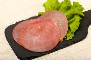 Sliced sausage dish photo