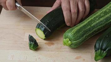 Slicing zucchini. Fresh zucchini on cutting board video