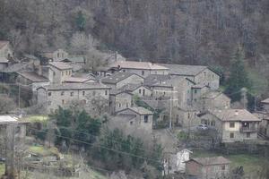 Old frassinedolo medieval village walls in valley around Bismantova stone near castelnovo ne monti photo