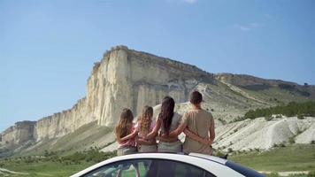 Parents and two little kids on summer car vacation video