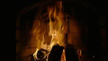 Smouldering coals in a fireplace. Slow motion video