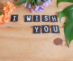 I Wish You text on tag over wood table. photo