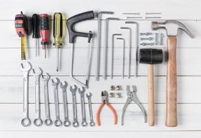 set of tools supplies on wood background photo