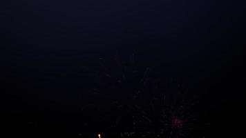Bright festive fireworks in the night sky. Colorful fireworks in the sky video