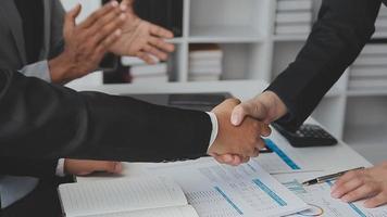Entrepreneurs and business people conference in modern meeting room, happy multiracial coworkers have fun cooperating working together at office meeting, asian teamwork concept video