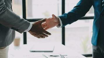 Business handshake for teamwork of business merger and acquisition,successful negotiate,hand shake,two businessman shake hand with partner to celebration partnership and business deal concept video