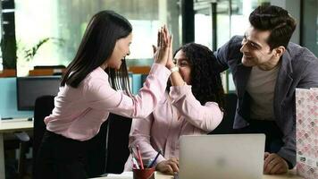 Stock Video of Happy coworkers sharing success celebrating good teamwork result
