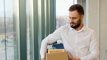 Unemployed man leaves of workplace. Dismissal from work. Job loss. Unemployment video