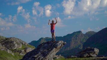 The girl travels through the mountains of Norway. She's funny and happy. 4K video