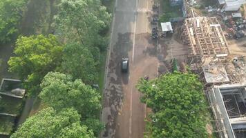 Capturing Movement Aerial Footage of Black Car Traveling Along Road video
