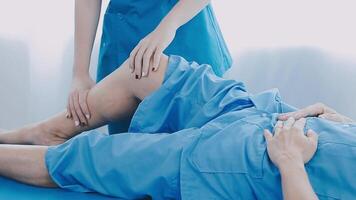 Doctor working with patient in hospital, closeup. Rehabilitation physiotherapy video