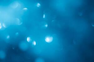 Turquoise lights bokeh background. Blue lights. photo
