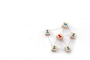 People icon on wooden block with connection line symbol. Leadership, coordination, teamwork, social connections and communication network. photo