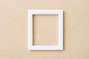 Blank White Frame on Beige Background photo
