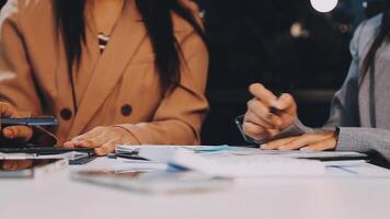Office colleagues have a casual discussion. During a meeting in a conference room, a group of business teem sit in the conference room new startup project video