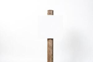 Blank sign on wooden post photo