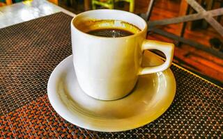 Cup of americano black coffee in restaurant cafe in Mexico. photo
