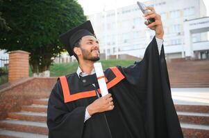 indian male graduate taking selfie photo