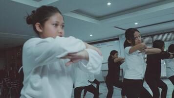 Young dancers practicing in a studio video