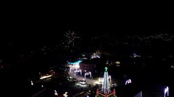 Colorful fireworks burst in the night sky over a cityscape video