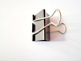Black paperclip on a white background photo