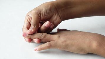 A person is holding their finger to their hand video