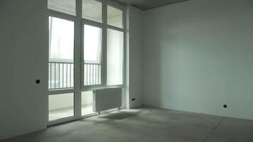 A room with a window in an apartment that is being renovated video