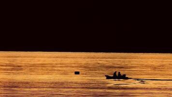 Beautiful morning view of sunrise with fishing boats at Pak Nam Sichon, the estuary area in Chumphon Province, Thailand. Fishermen go fishing with long-tail boats in the sea in the morning. video