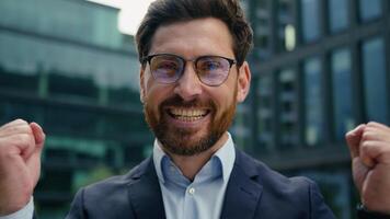 Portrait adult happy winner champion Caucasian business man male guy middle-aged businessman employer entrepreneur celebrate in city reaction win victory winning achieve triumph glad yelling success video