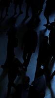 Silhouetted Figures in a Dimly Lit Environment Capturing the Essence of Urban Life video
