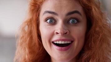 Close up Caucasian woman amazed wonder surprised happy face excited winner emotional girl portrait lady looking at camera with big eyes open mouth shock win victory achieve good news female at home video