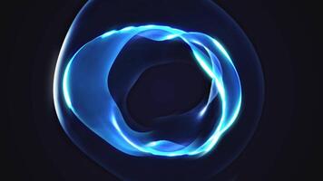 A blue glowing light is shown in the middle of a dark background video
