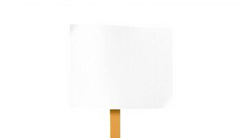 white rectangular sign on a wooden stick photo