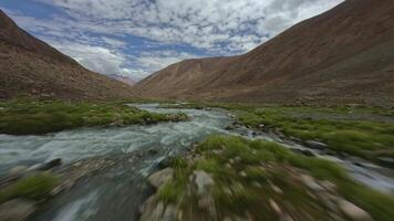 FPV drone flies over a mountain river in Tibet video