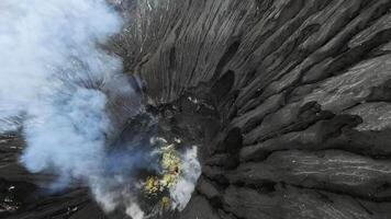 smoking mouth of a volcano in Indonesia video
