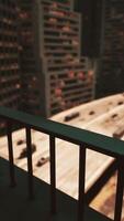 A cityscape captured from a balcony overlooking a bustling street video