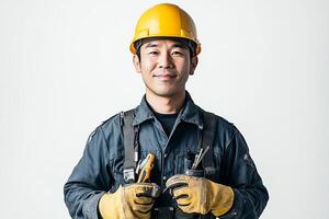 Asian male construction worker holding tools photo