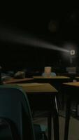 A dark room with many tables and chairs video
