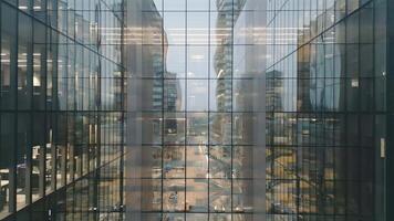 Vilnius, Lithuania -28th november, 2024 - aerial panning view shared common business office building with glass exterior. Anteja medical clinic. Telia telecommunications company video