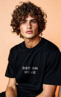 Young man with curly hair wearing t-shirt mockup sitting on chair psd